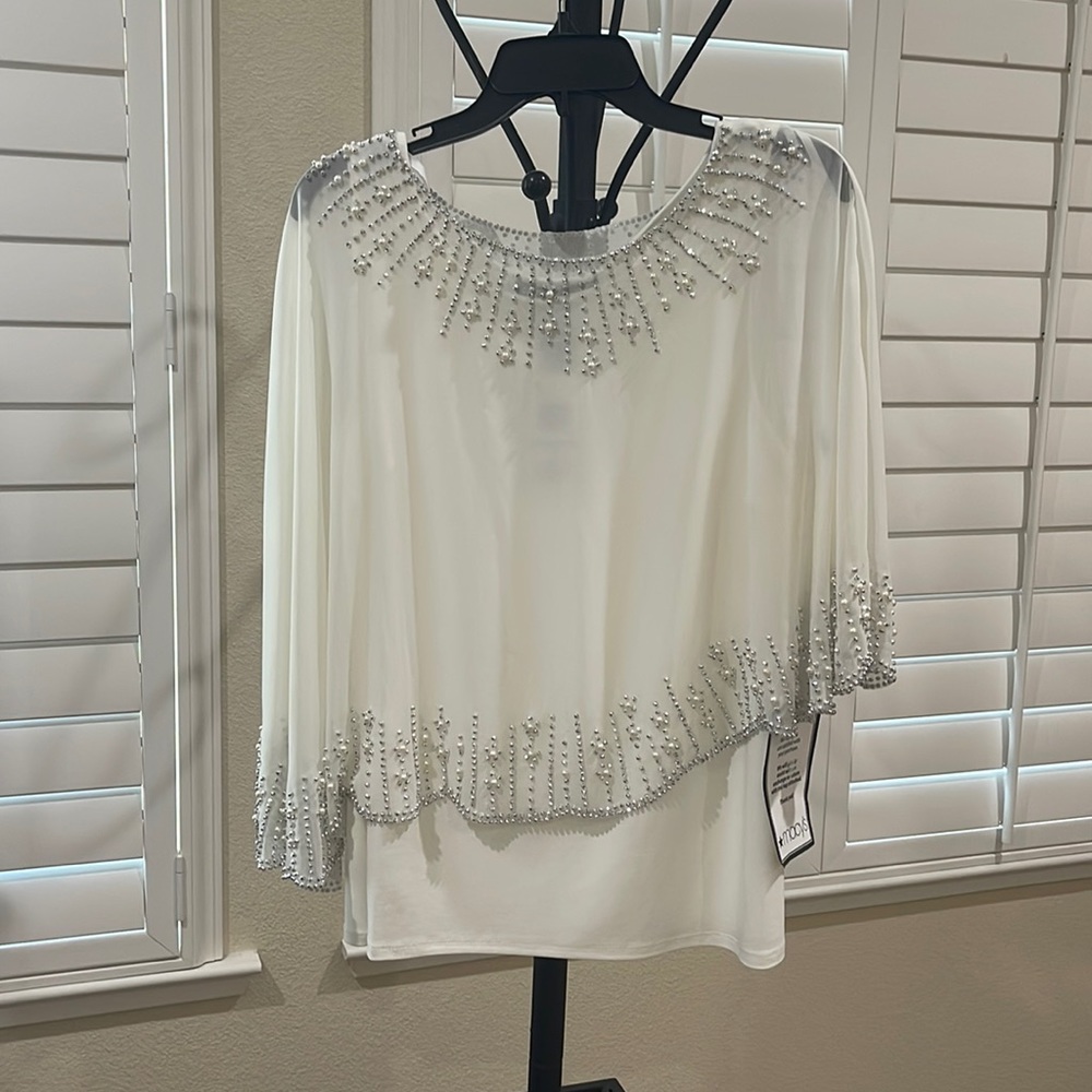 White long sleeve blouse with sliver accents